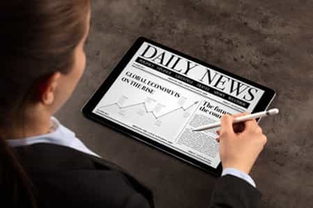 Business woman reading news on tablet-1-1