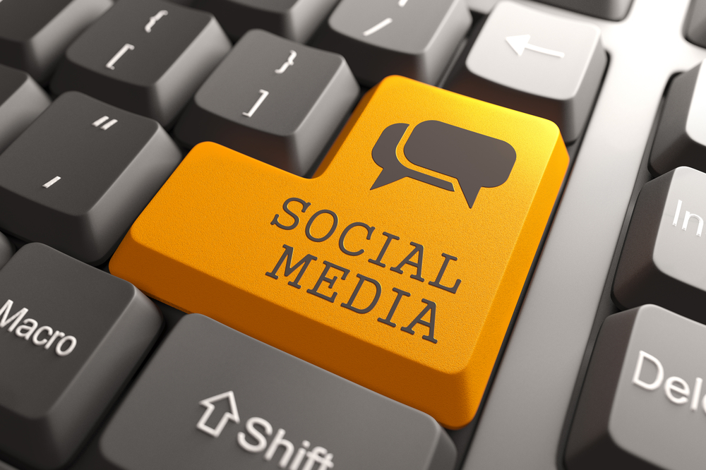 Social Media. Orange Button on Computer Keyboard. Social Media Concept.